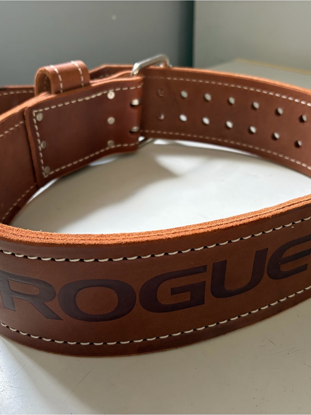 Rogue Weightlifting belt Size 32 with opportunity to decrease size max size 34